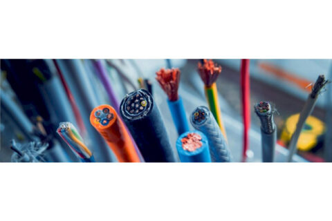 Close-up view of various network cables with exposed copper wires, representing cabling and connectivity solutions.