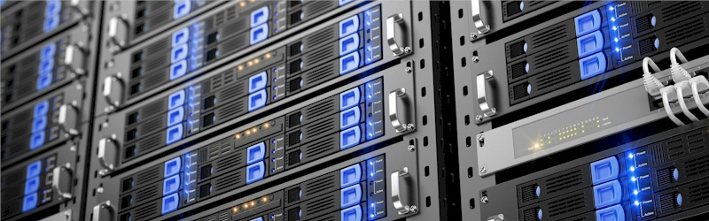 Close-up view of multiple server racks with blue LED lights and network cables.