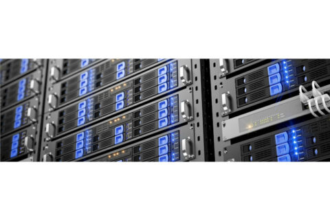 Close-up view of multiple server racks with blue LED lights and network cables.
