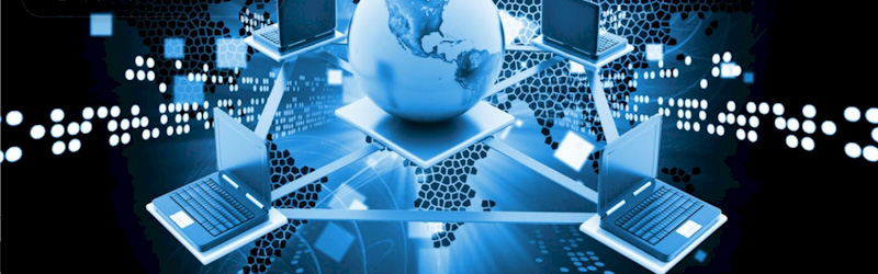Globe connected to laptops symbolizing global networking and data exchange