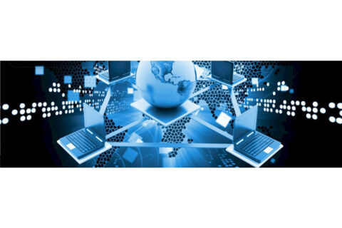 Globe connected to laptops symbolizing global networking and data exchange